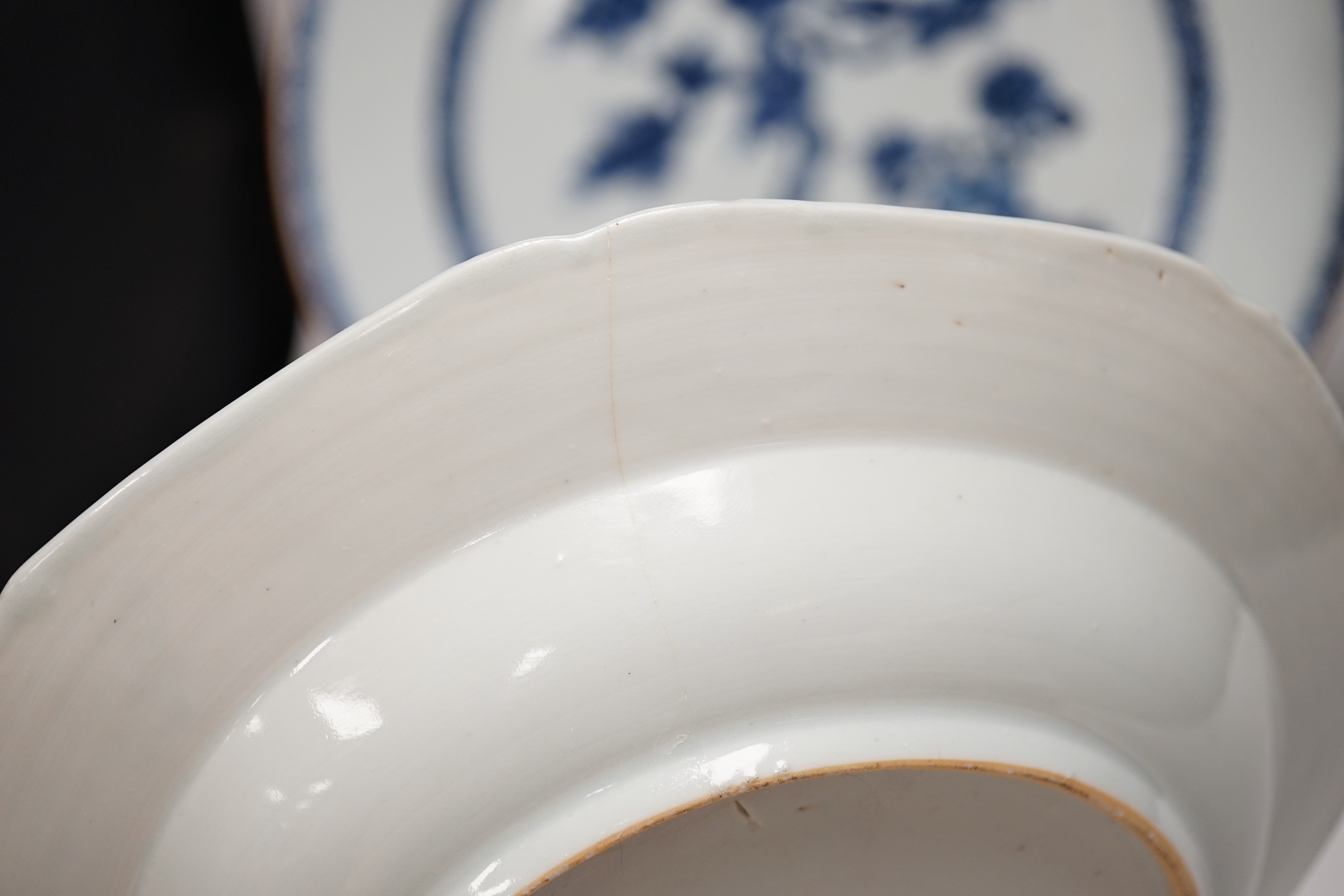 An 18th century Chinese export blue and white charger, a similar soup bowl and a late 19th century enamelled blue ground vase, 32cm